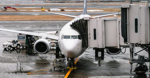 A large passenger jet is parked at an airport.