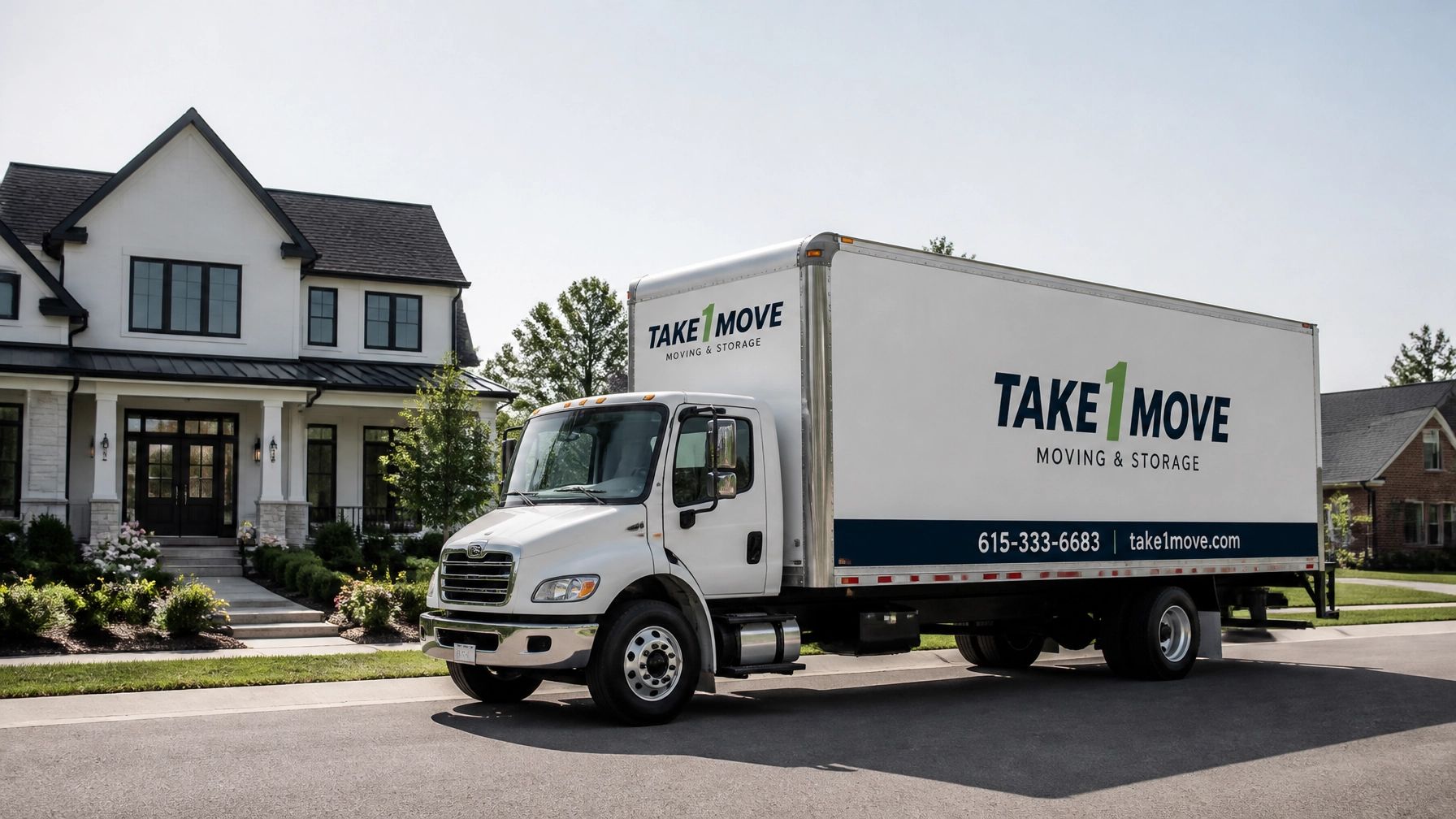 White moving truck parked on a suburban street in front of a house, with “TAKE MOVE” on the side.