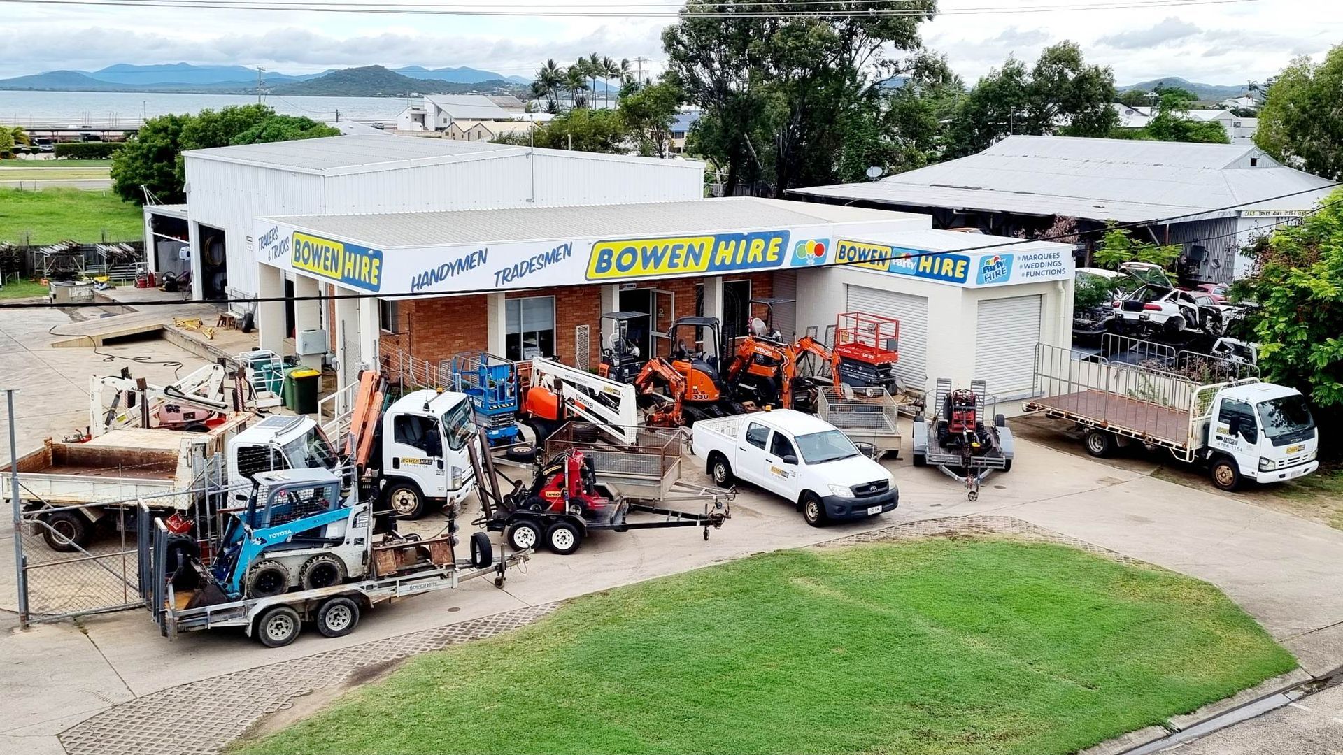 Aerial View of A Roadside Auto Repair Shop with Several Tow Trucks — Bowen Hire in Airlie Beach, QLD