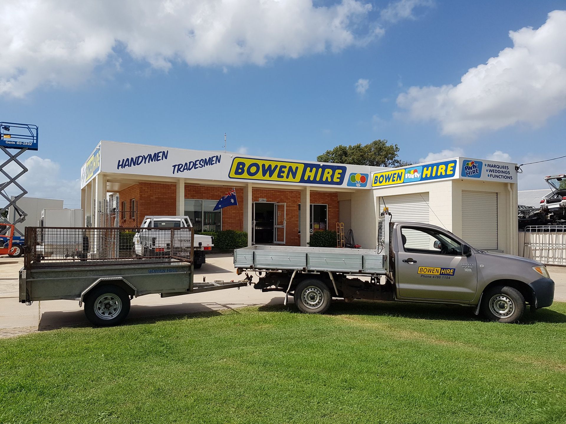 Flatbed Truck Parked in Front of A Bowens Hire Storefront — Bowen Hire in Collinsville, QLD