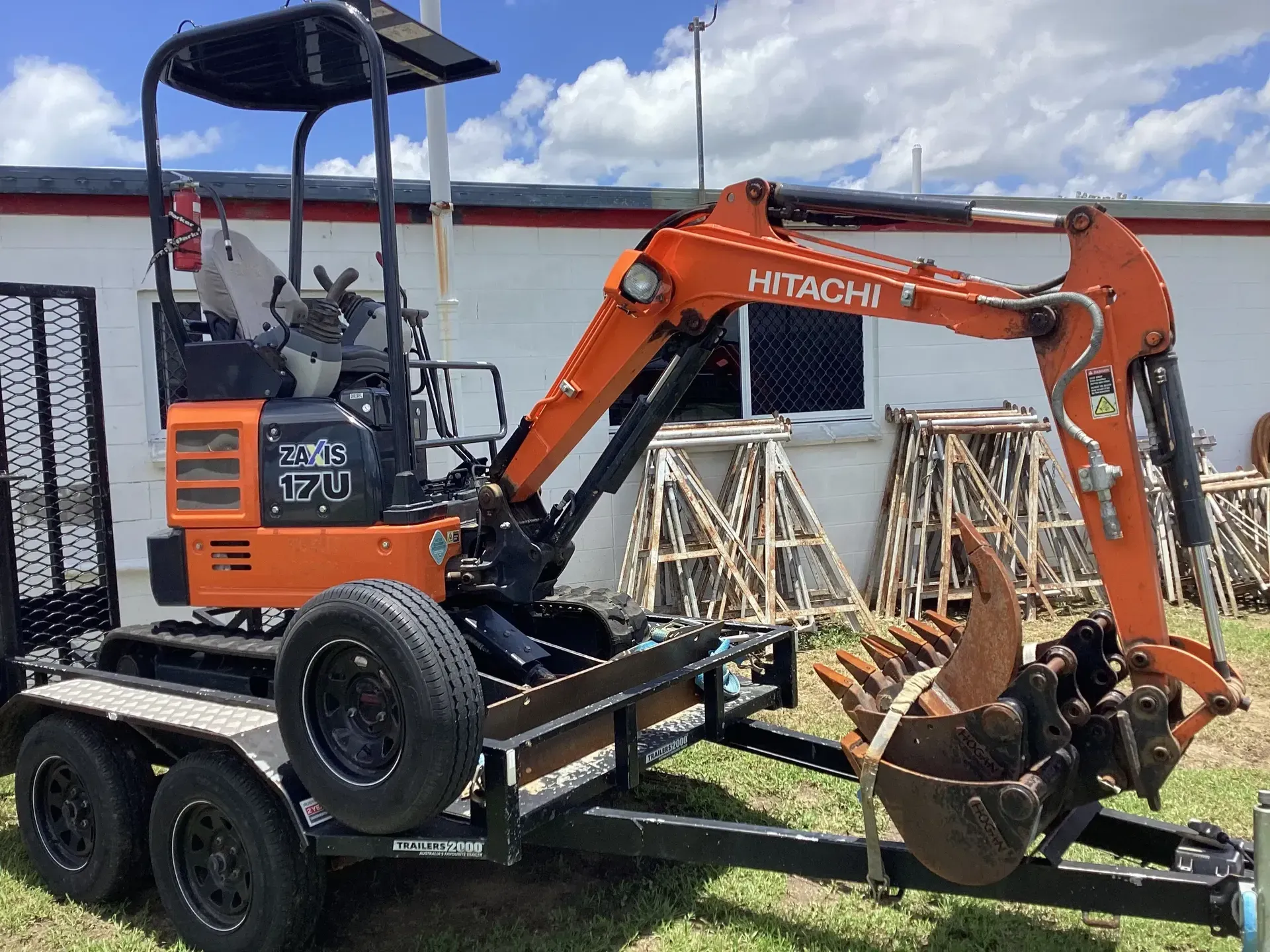 Orange Hitachi Mini Excavator with Bucket on A Trailer — Bowen Hire in Collinsville, QLD