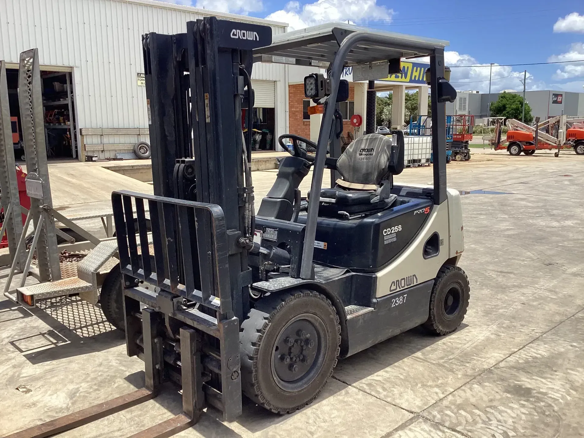 Black Forklift Parked on Concrete in An Industrial Yard — Bowen Hire in Collinsville, QLD