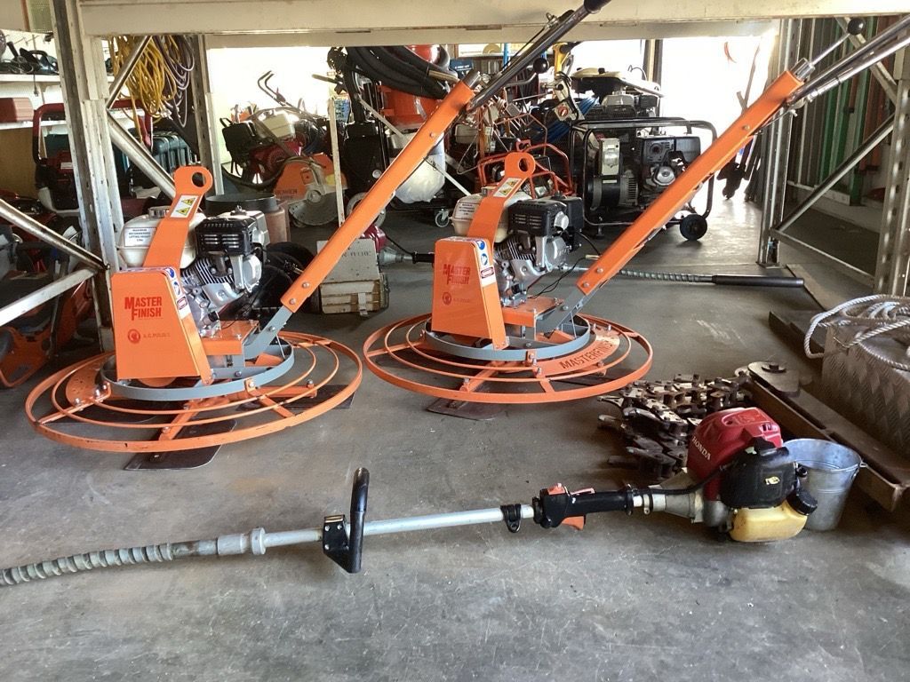 Orange Gas-powered Trimmer-like Machines in a Garage — Bowen Hire in Bowen, QLD
