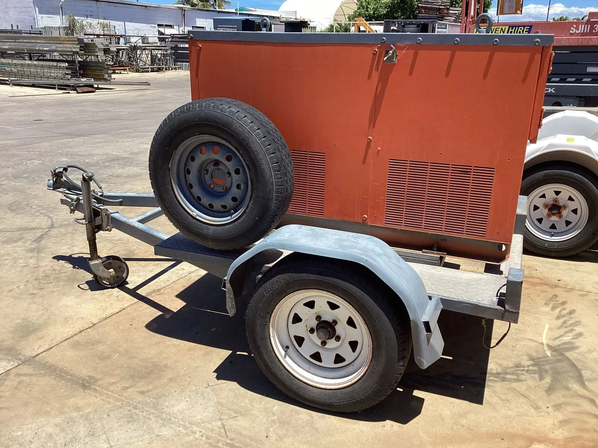 An Orange, Box-shaped Industrial Generator — Bowen Hire in Bowen, QLD
