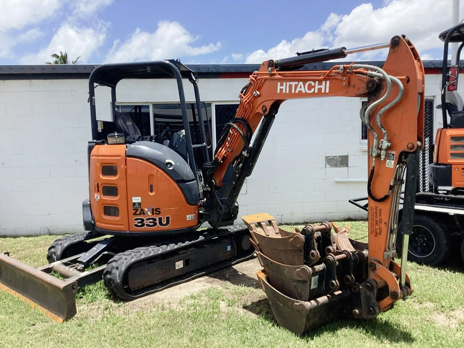 An Orange Hitachi Zx33u Compact Excavator — Bowen Hire in Airlie Beach, QLD