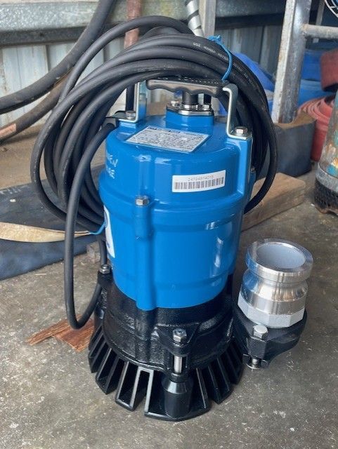 Blue Submersible Water Pump with Black Base and Coiled Hose — Bowen Hire in Proserpine, QLD
