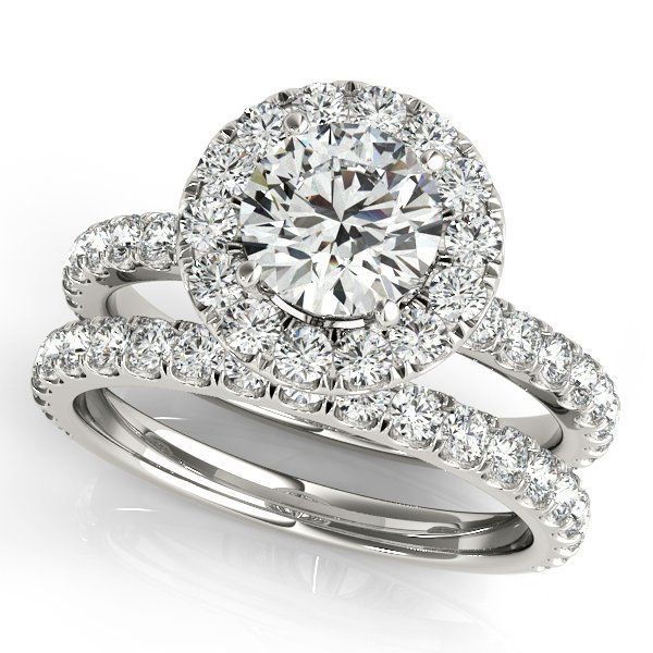 Diamond engagement ring set with halo and matching band on a white background