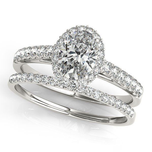 Two oval diamond rings with pavé bands, set in silver on a white background