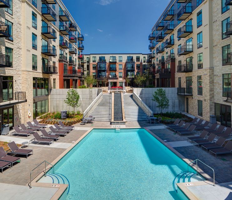 A large swimming pool in the middle of a building