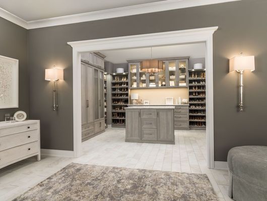 A rendering of a walk in closet in a bedroom.