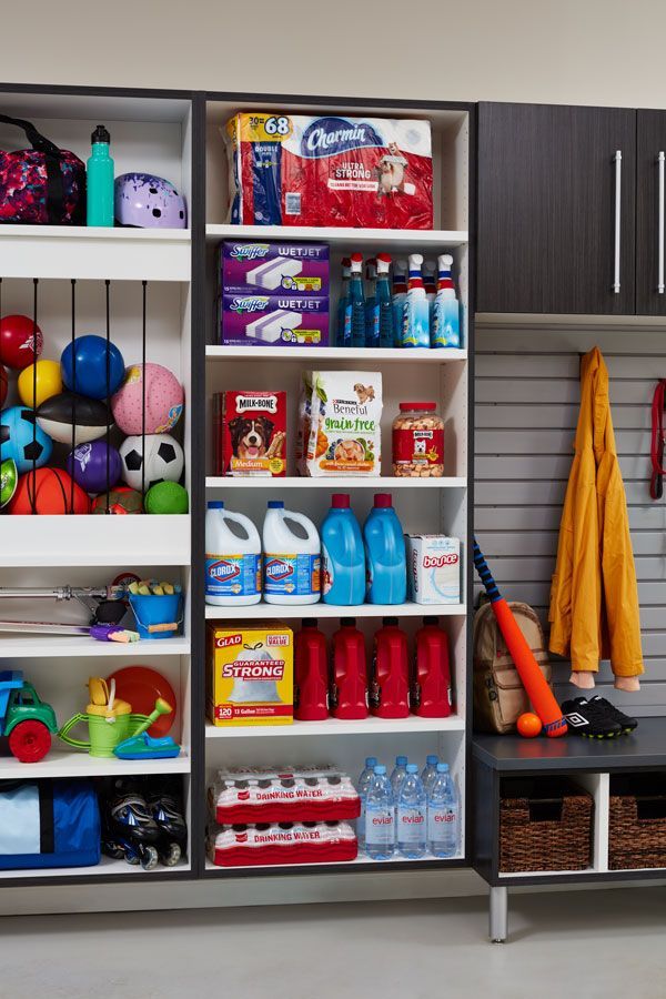 A closet filled with lots of cleaning supplies and toys.