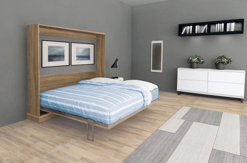 A bedroom with a bed that is pulled out of the wall.