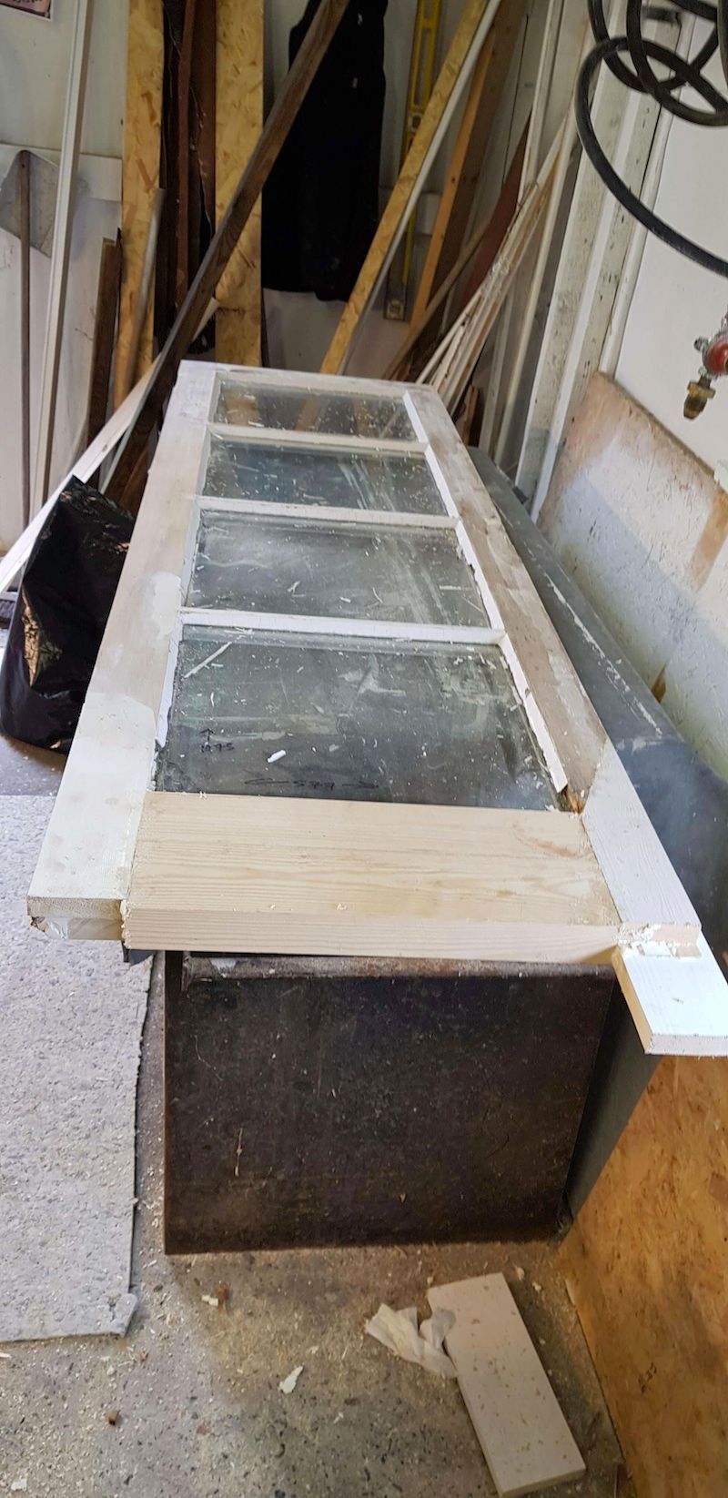 a wooden patio door with rotted timber