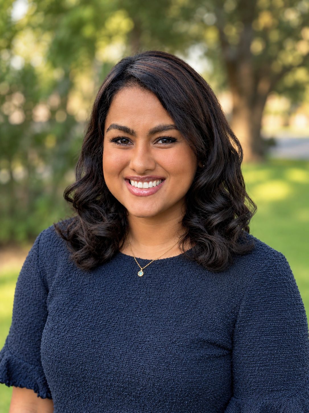 Debbie Mathew in blue blouse