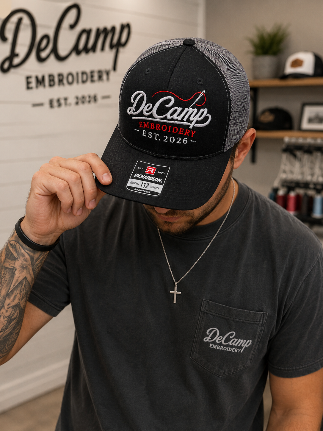Black Richardson cap with DeCamp Embroidery logo and