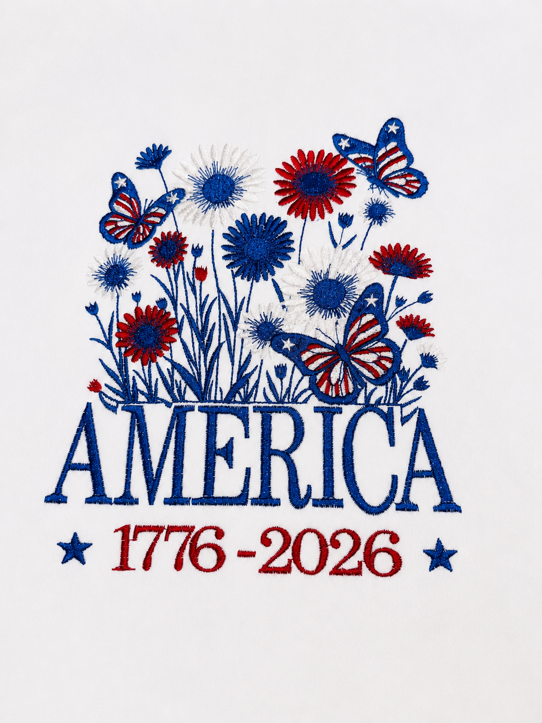 Woman wearing a white patriotic “America 1776–2026” T-shirt with blue and red floral print