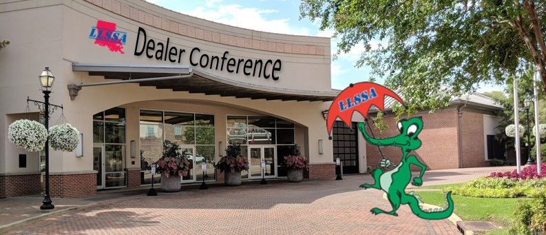 Cartoon alligator holding an umbrella that says