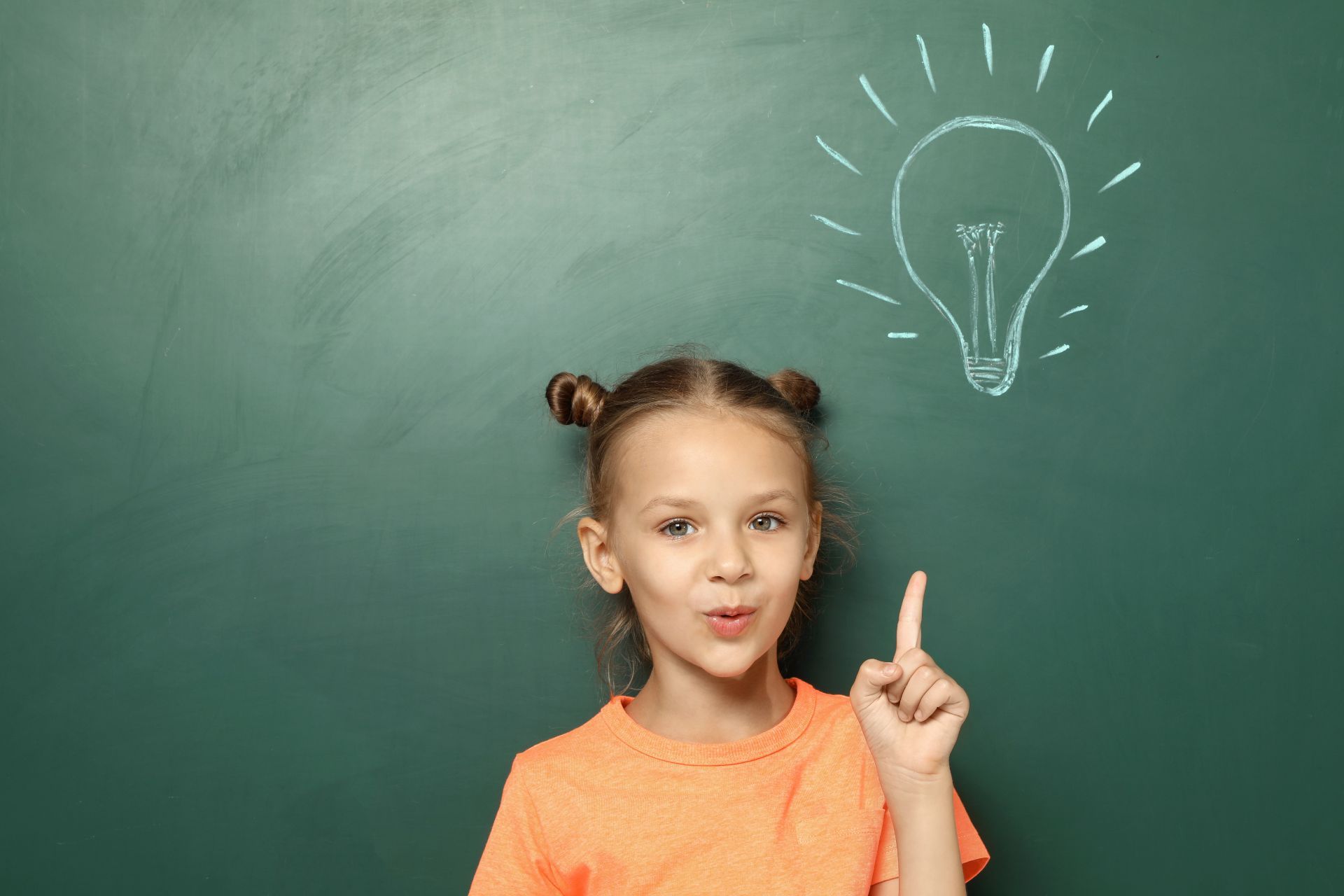 girl by a blackboard