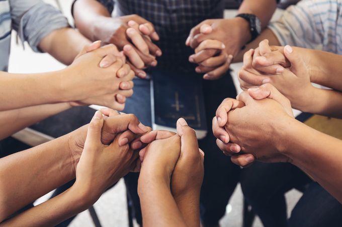 Group community People diverse hands holding circle to pray for God each other