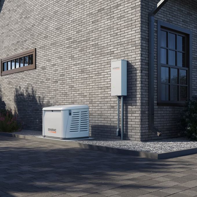 Outdoor HVAC unit beside a brick building with a wall-mounted electrical box and dark window