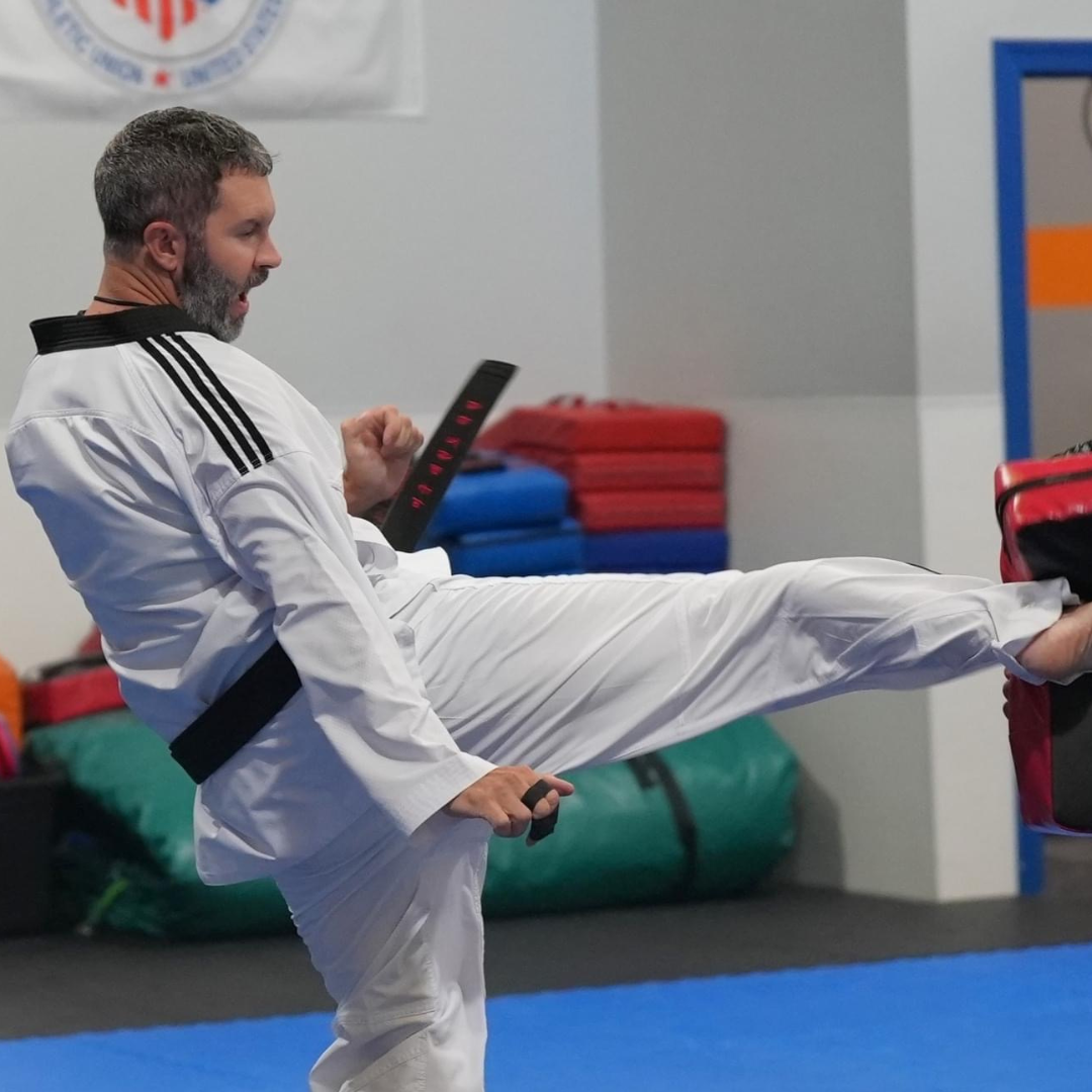 Master Dustin Sands demonstrating a Taekwondo kicking drill during adult martial arts class in Mt. Juliet.