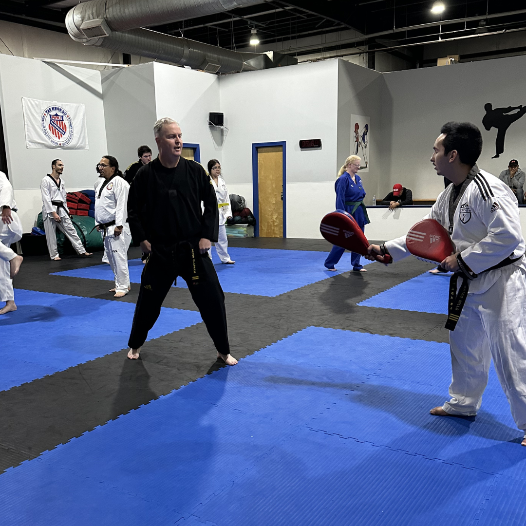 Adult martial arts students practicing Taekwondo kicking drills at Tennessee Taekwondo in Mt. Juliet.