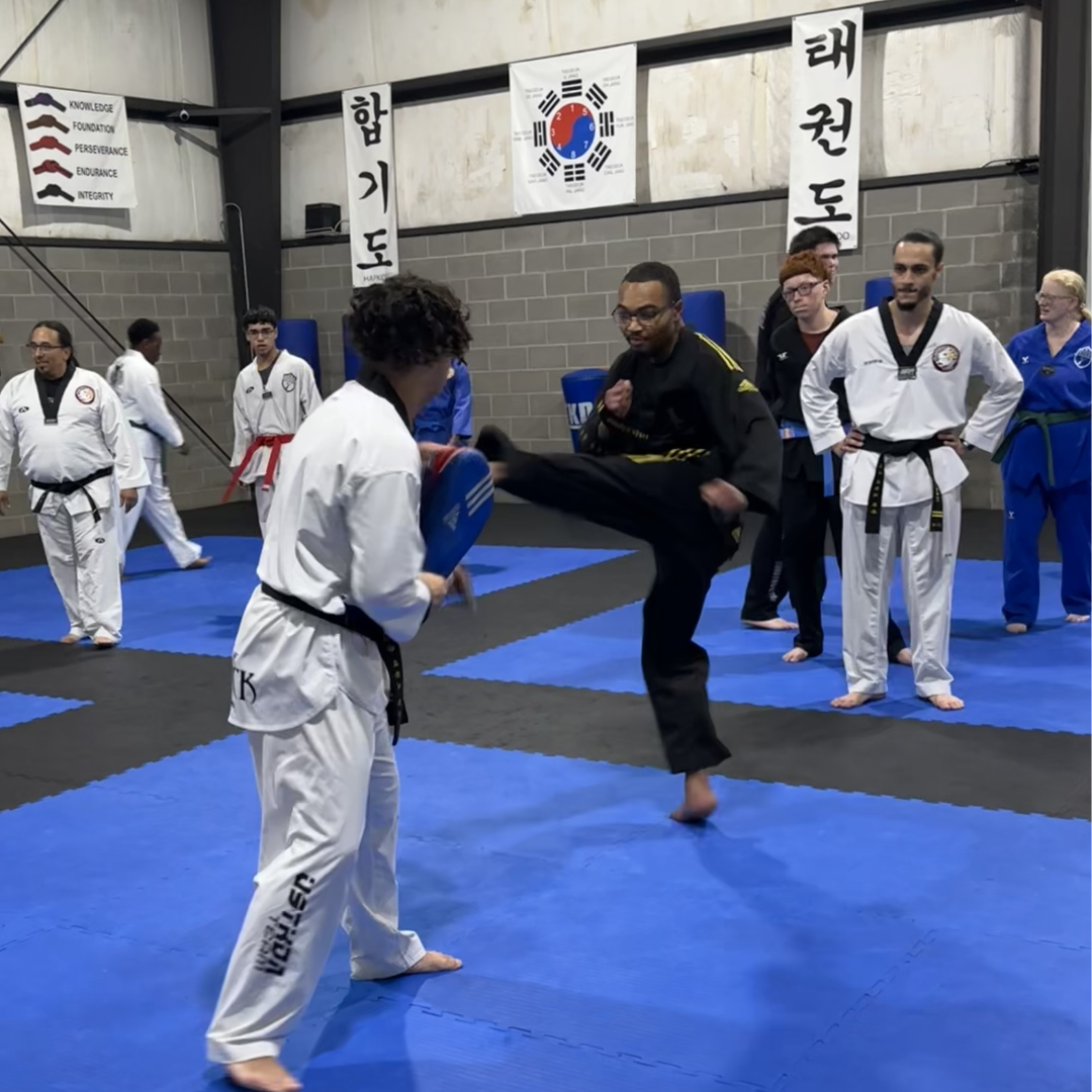 Adult martial arts student practicing target kicking drills at Tennessee Taekwondo in Mt. Juliet.