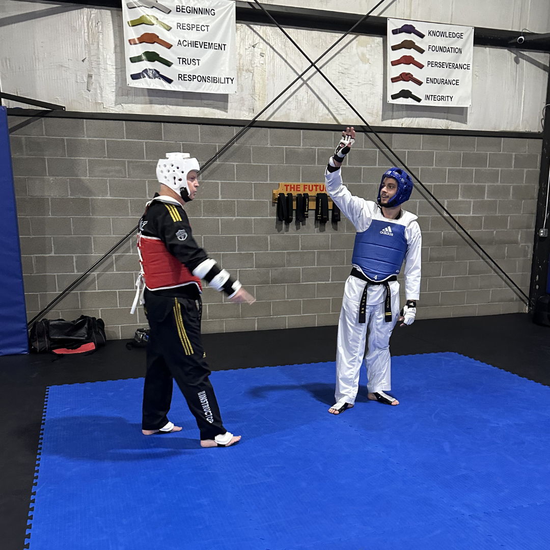 Adult students high five at Tennessee Taekwondo in Mt. Juliet, TN