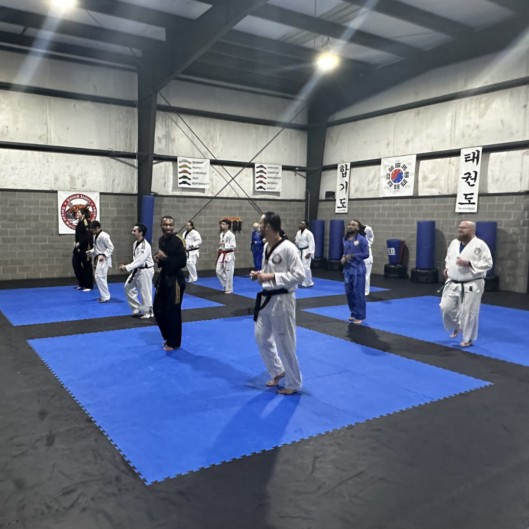 Adult Taekwondo students warming up before class at Tennessee Taekwondo in Mt. Juliet.