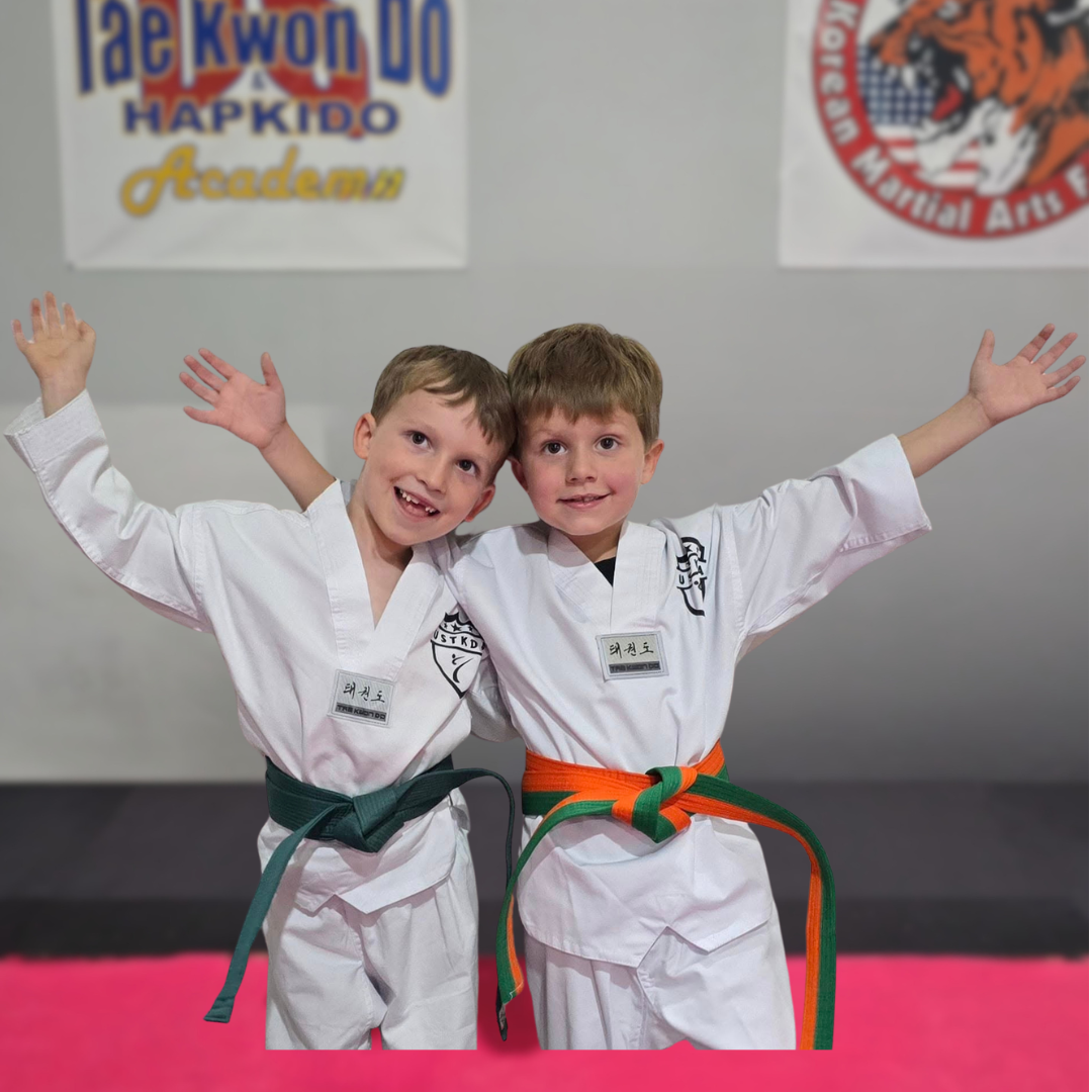 Young martial arts students smiling after class