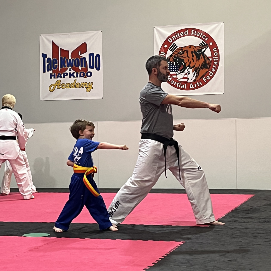 Kids martial arts students practicing forms with Master Dustin Sands