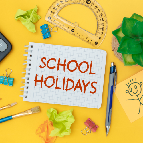 A notebook with the words school holidays written on it