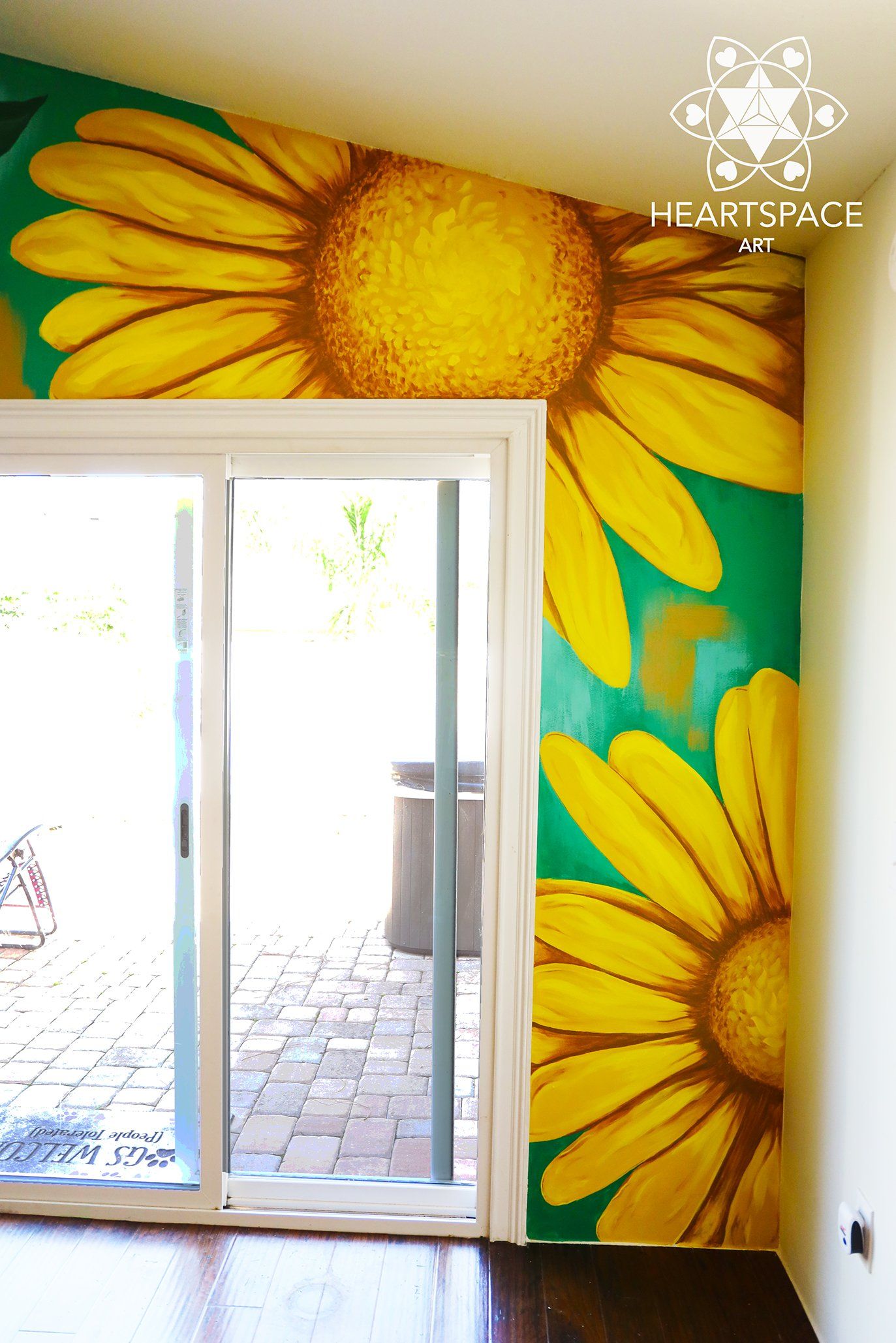 Hand painted mural located in residential home in Jacksonville, Florida. Features roses, daisies, tulips, and butterfly.