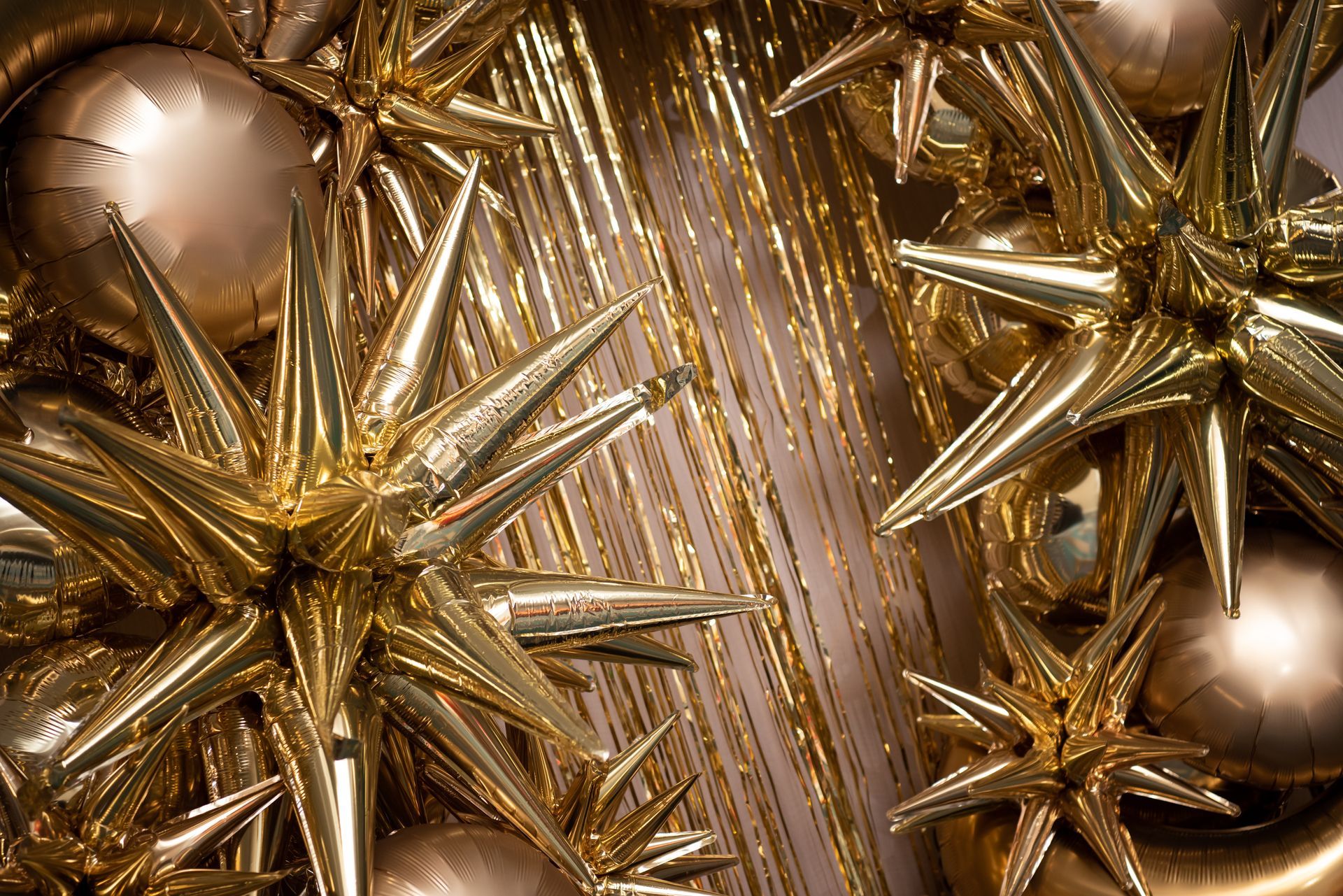 A close up of a bunch of gold christmas decorations