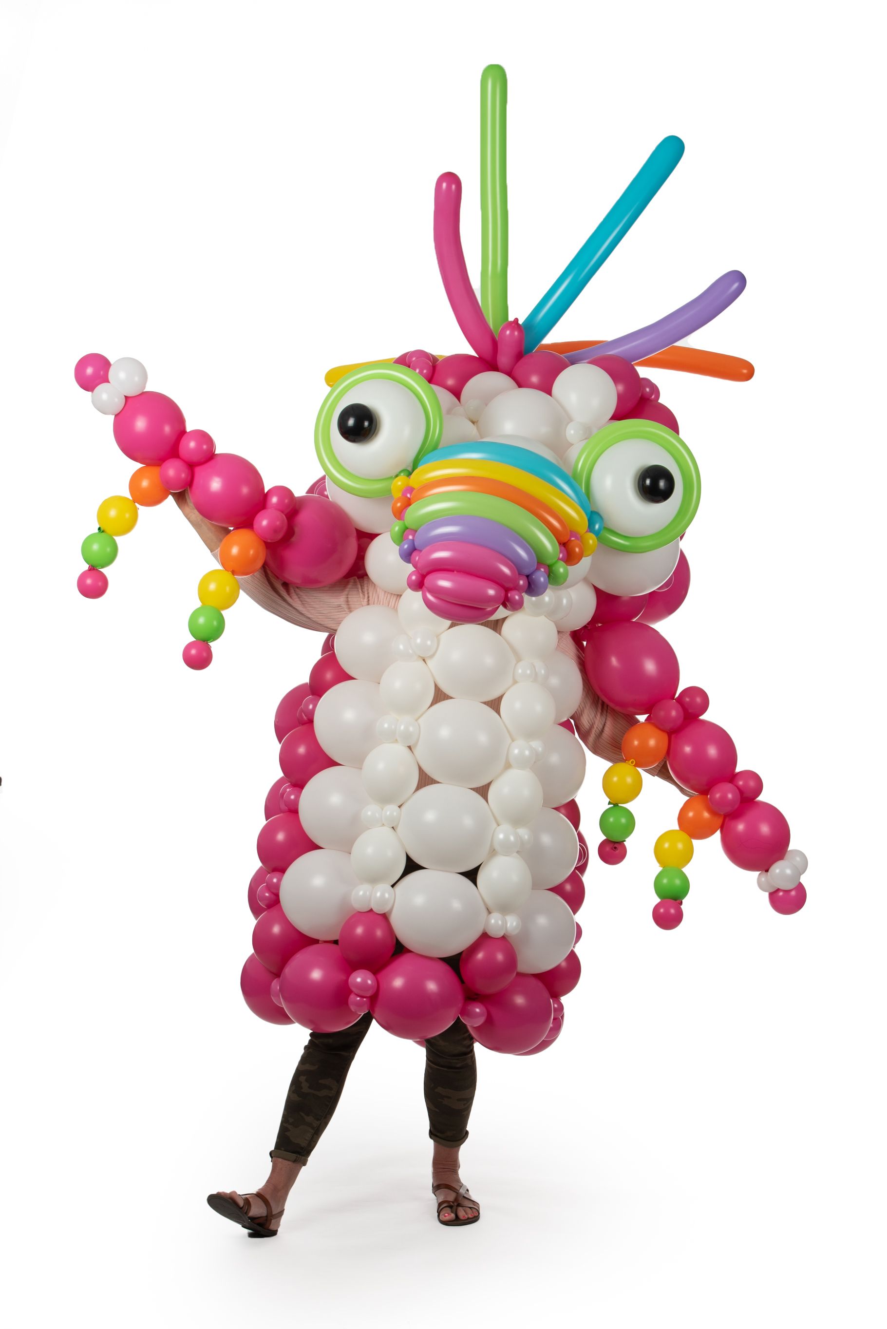 A person is dressed in a costume made of balloons