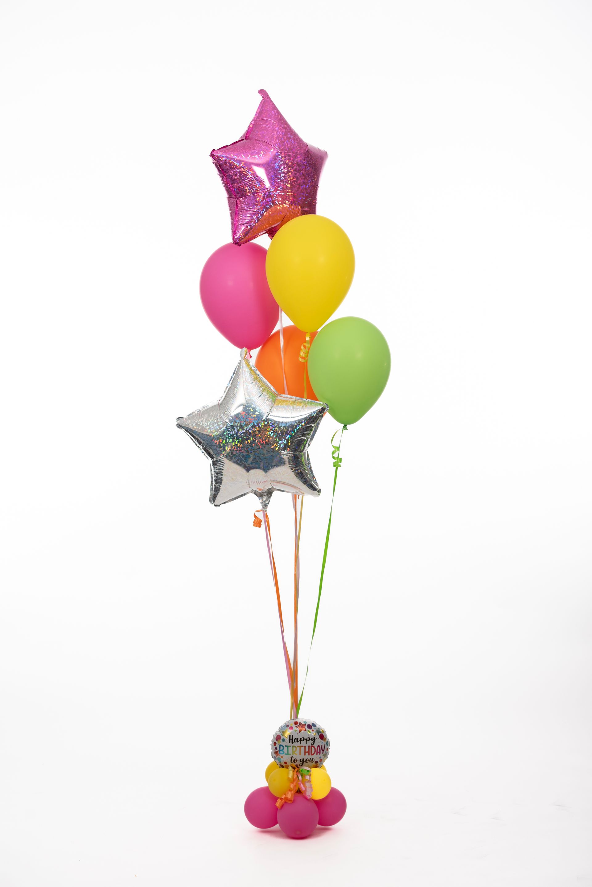 A bunch of colorful balloons are sitting on top of a table.