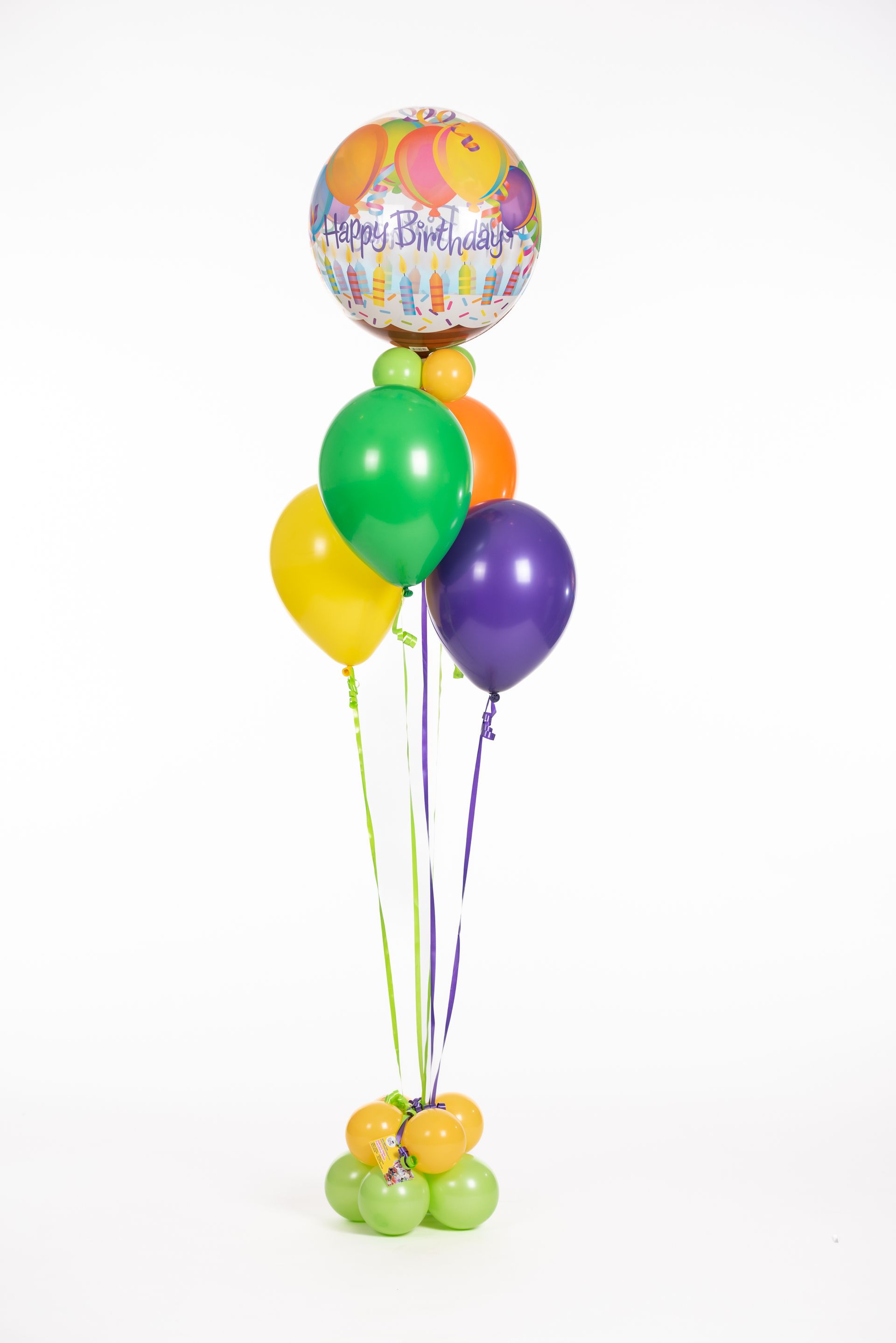A bunch of balloons are sitting on top of each other on a white background.