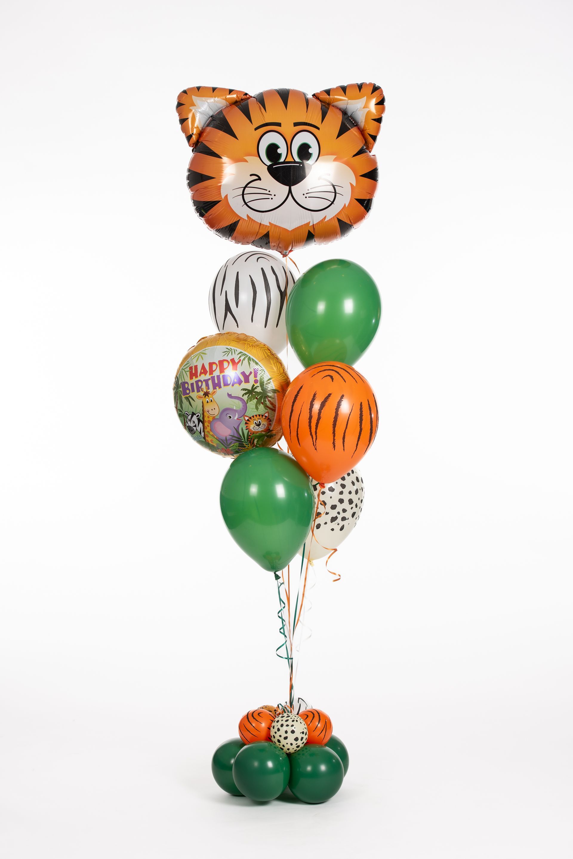A bunch of balloons stacked on top of each other with a tiger balloon in the middle.