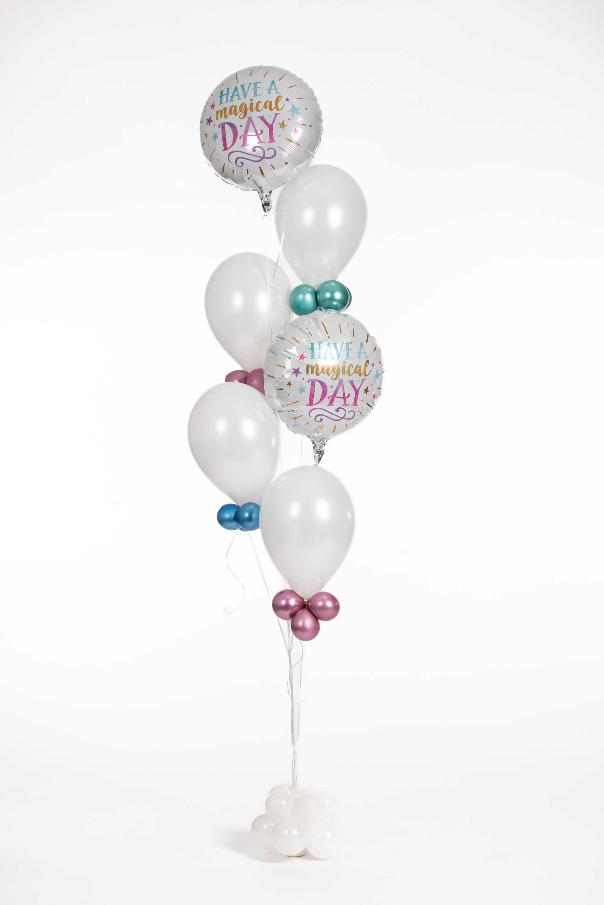 A bunch of balloons sitting on top of each other on a white background.