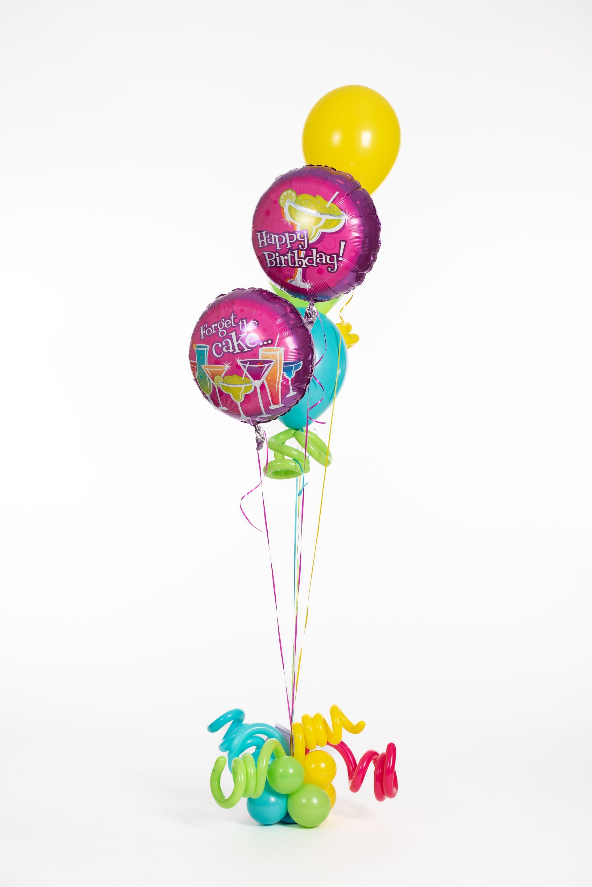 A bunch of balloons are sitting on top of each other on a table.