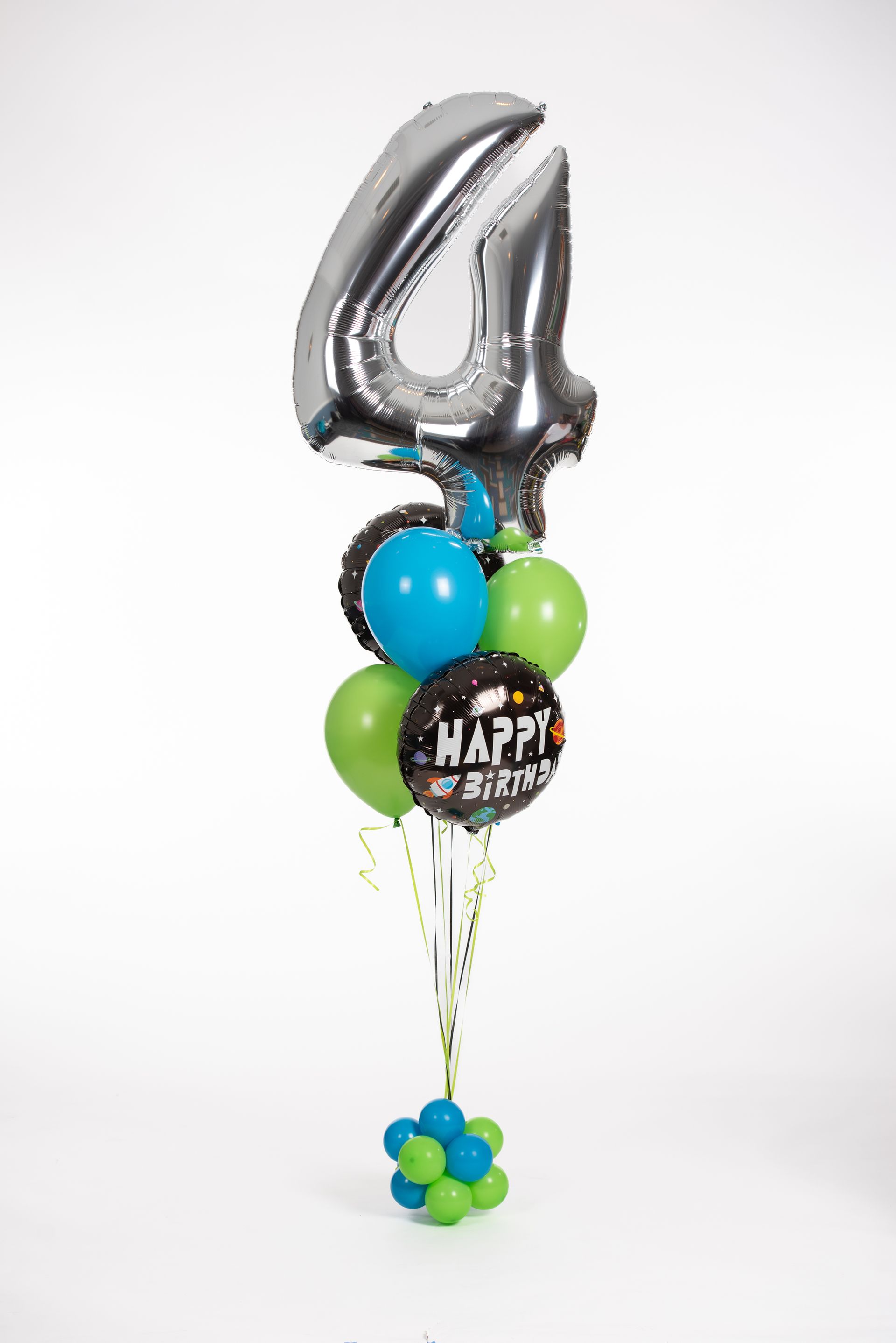 A bunch of balloons are sitting on top of each other on a table.