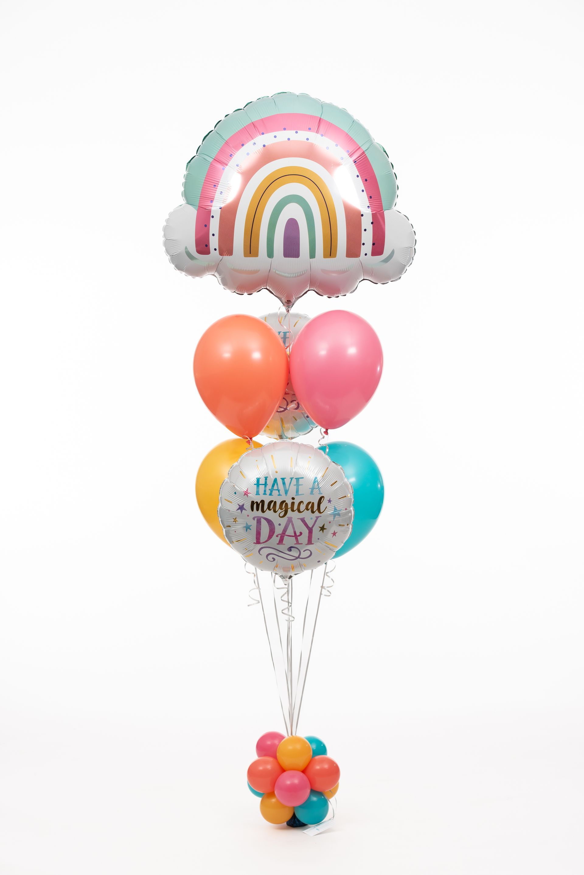 A bunch of balloons are sitting on top of each other on a table.