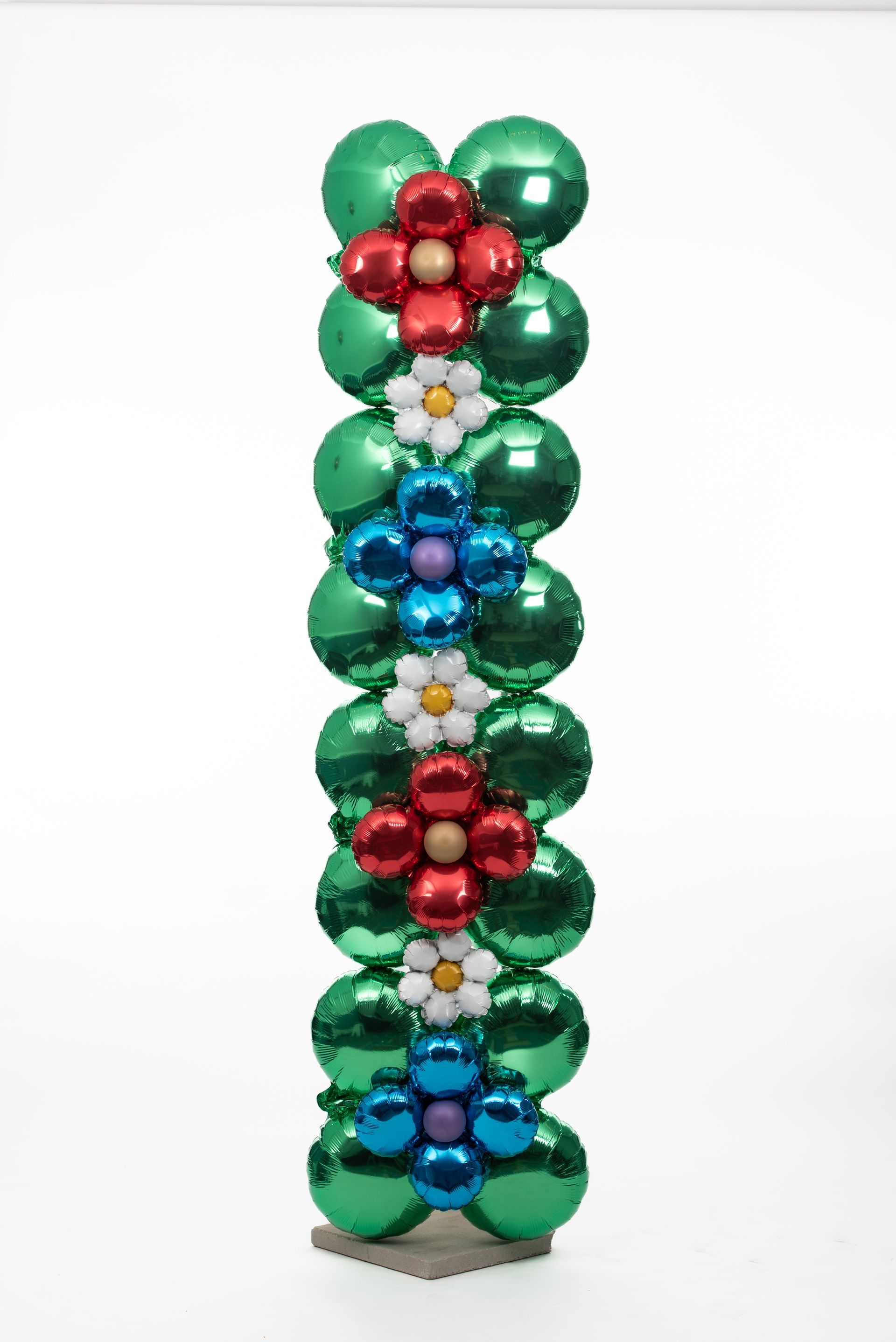 A row of green balloons with flowers on them