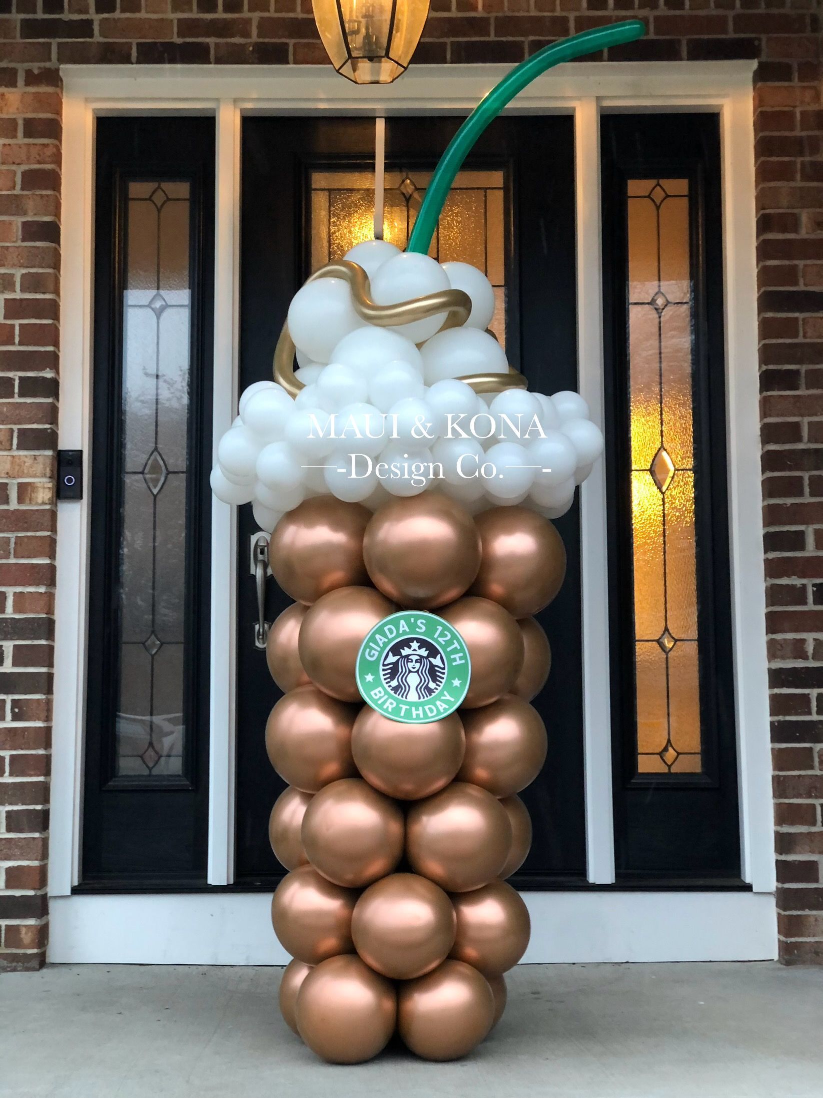 A balloon display in the shape of a starbucks cup