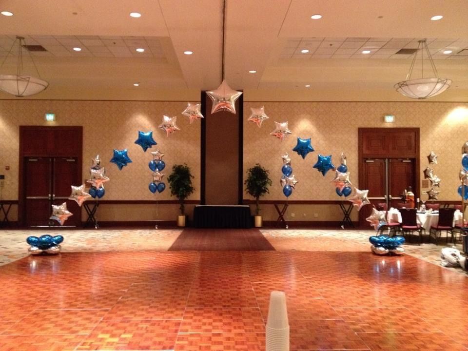 A large room with balloons and stars on the wall