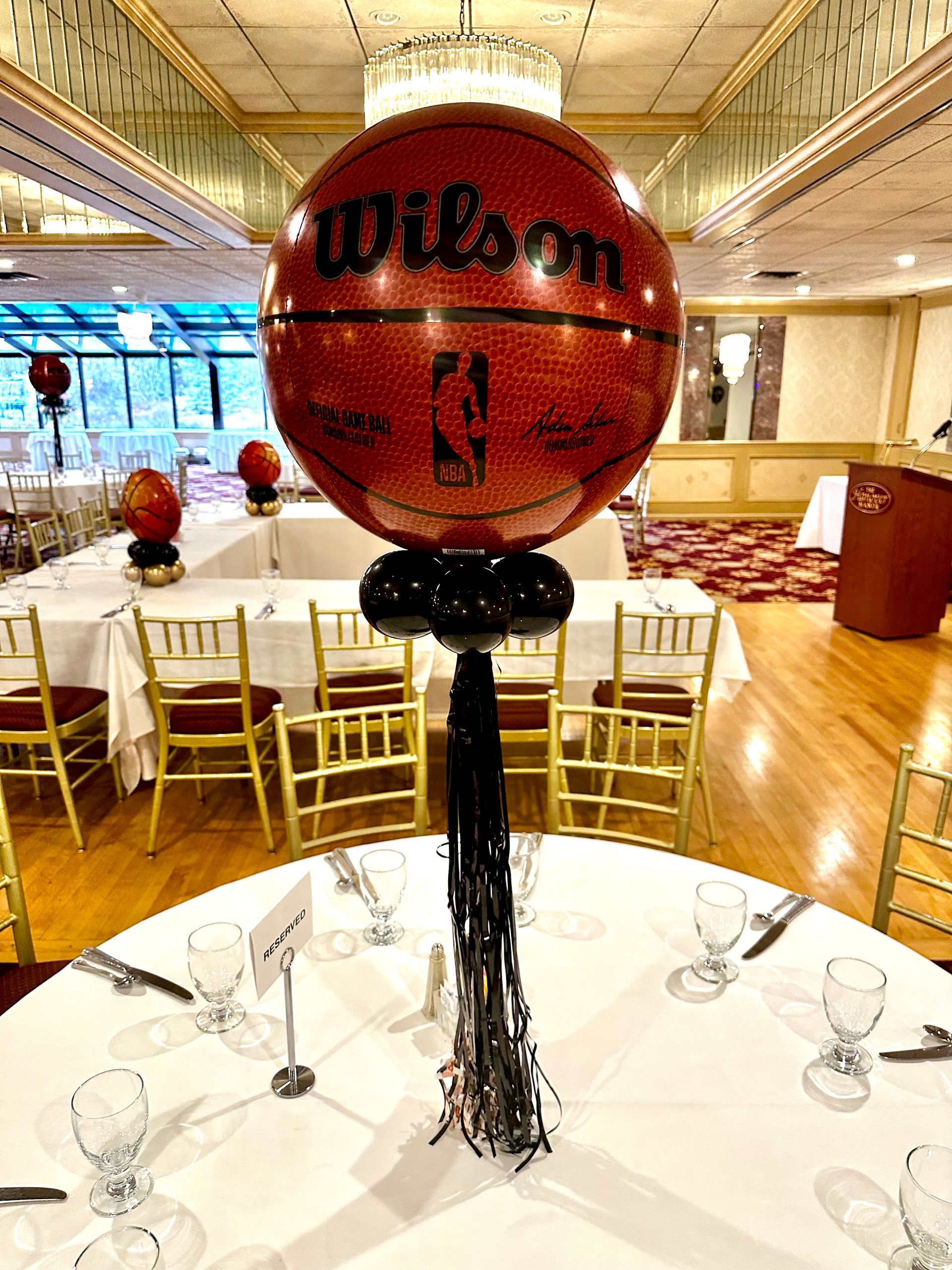 A wilson basketball balloon is sitting on top of a table.