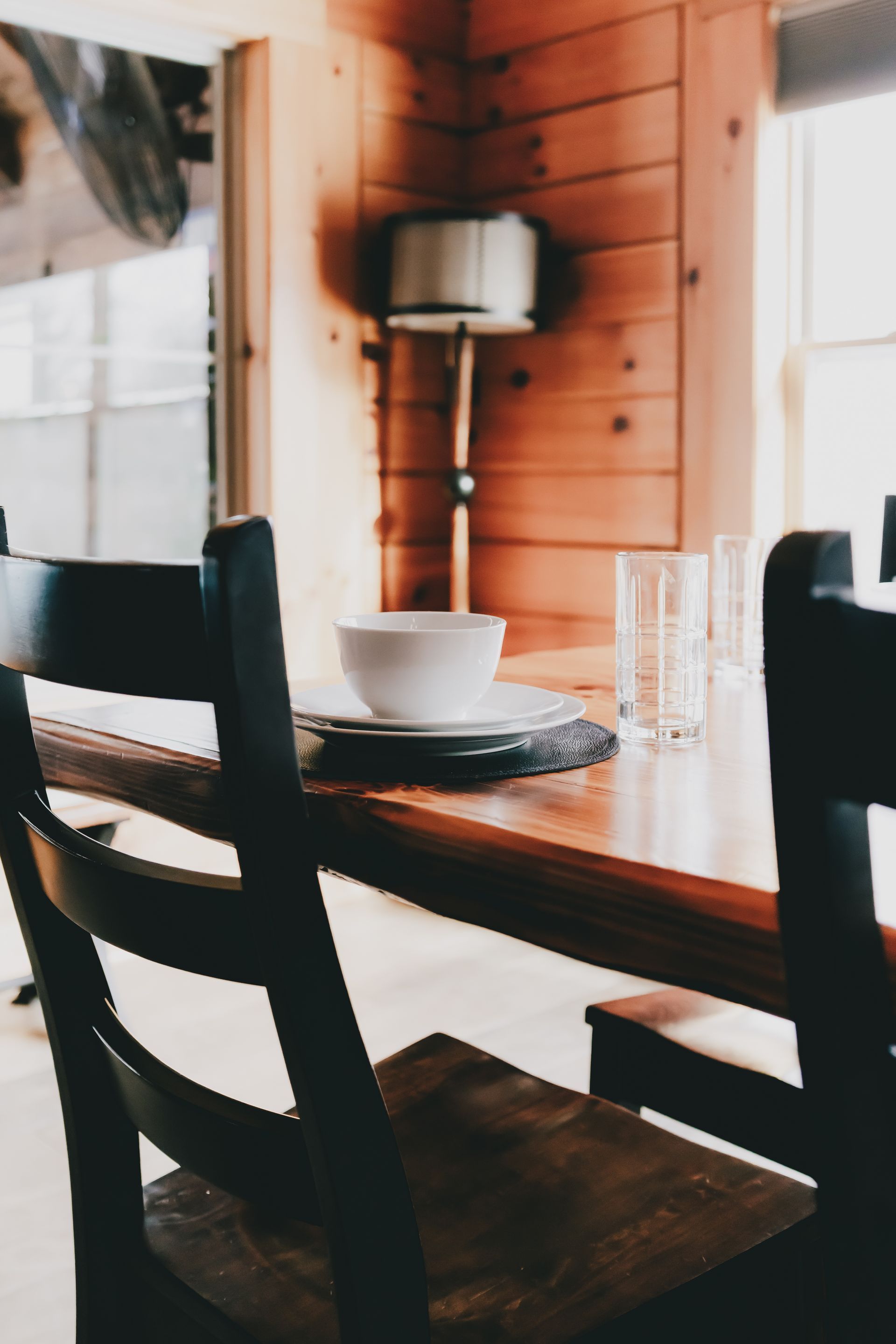 A dining room table with a bowl on it