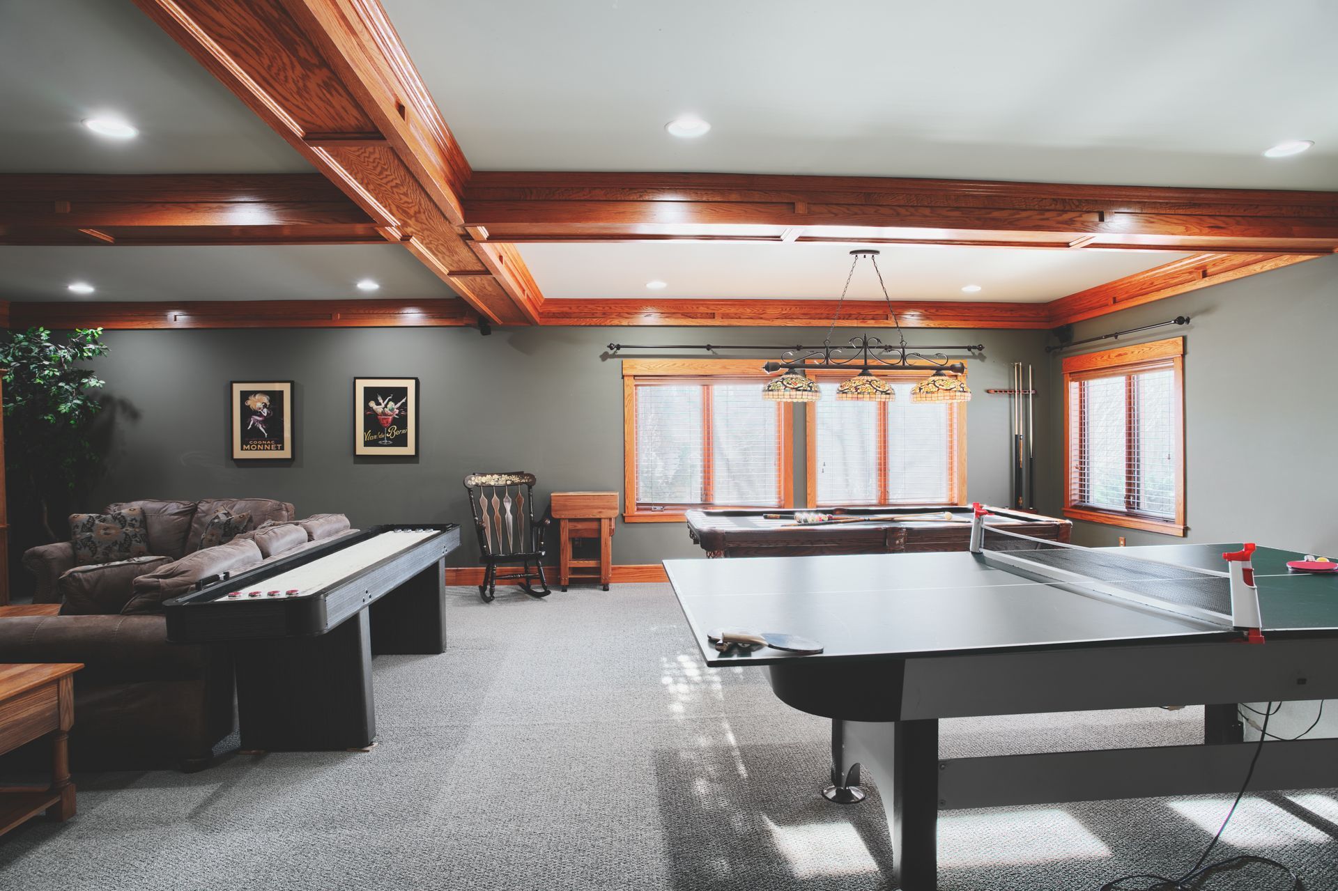 There is a pool table in the middle of the room.