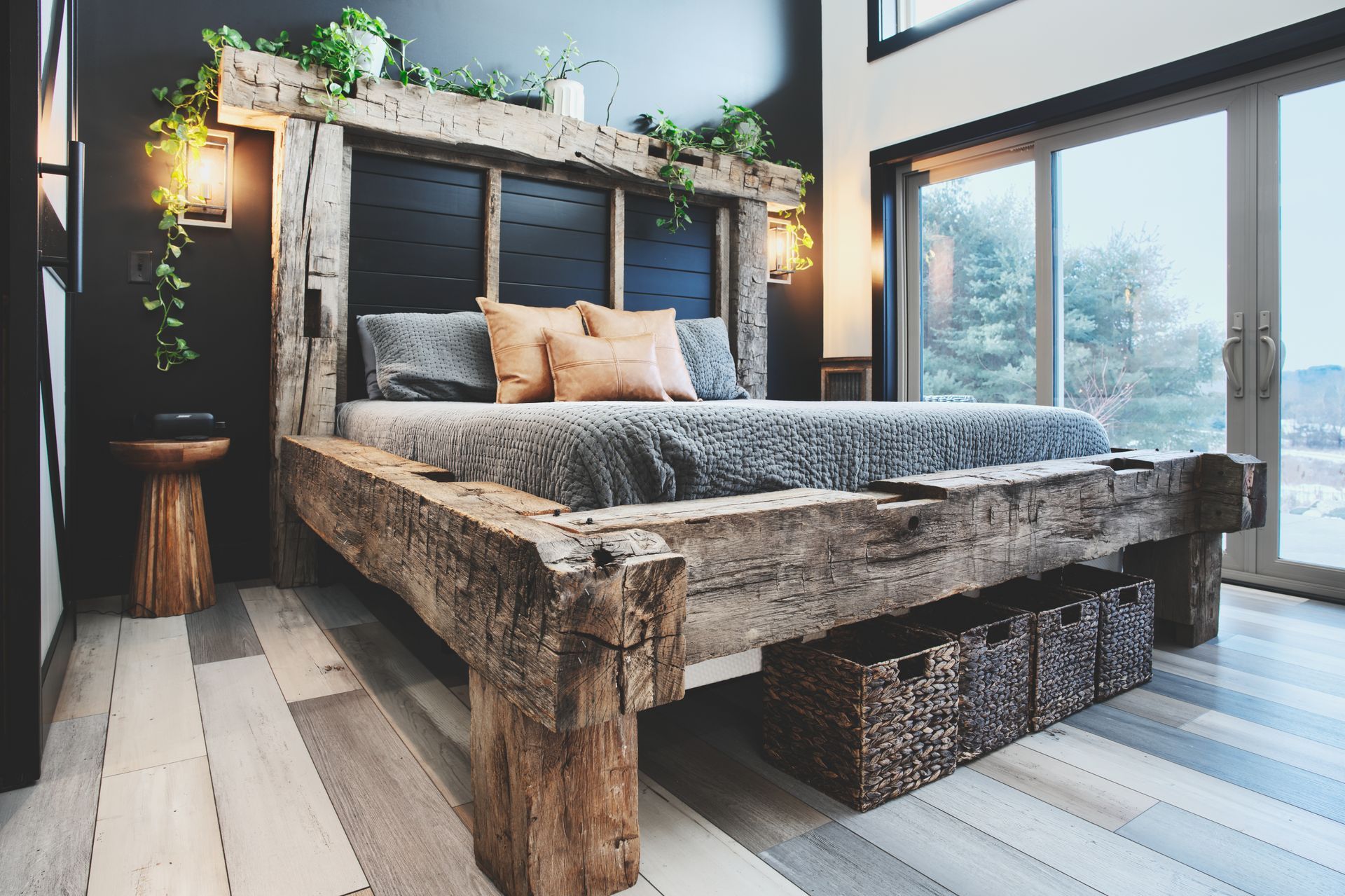A bedroom with a wooden bed and a wooden bench.