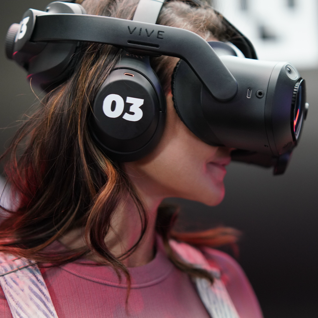 Person wearing VR headset in the GRID BEYOND immersive VR arena at The Grid Pleasant Grove Utah